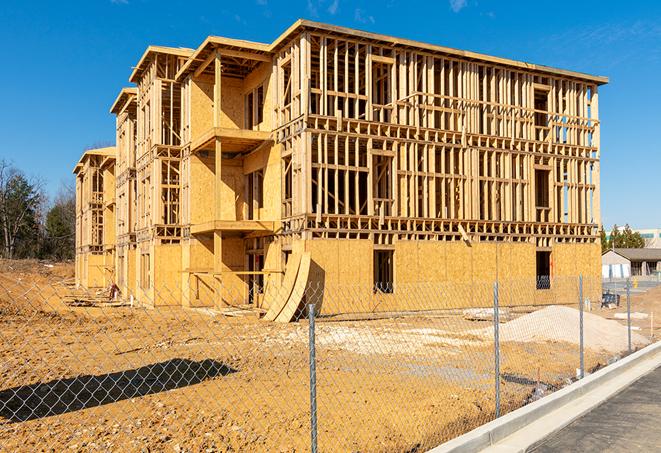 a close-up of temporary chain link fences enclosing a job site, signaling progress in the project's development in Middletown DE